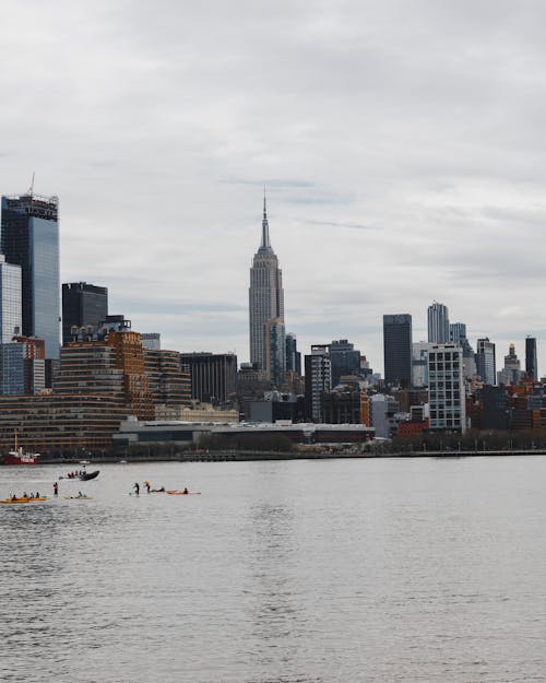 People Kayaking in Hudson River at New York City Harbor