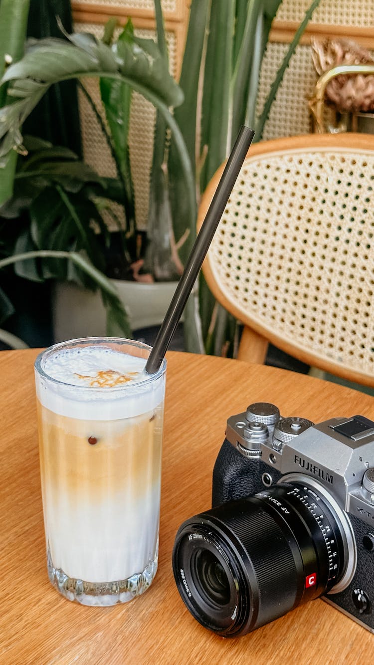 A Camera And A Coffee On The Table In A Modern Interior 