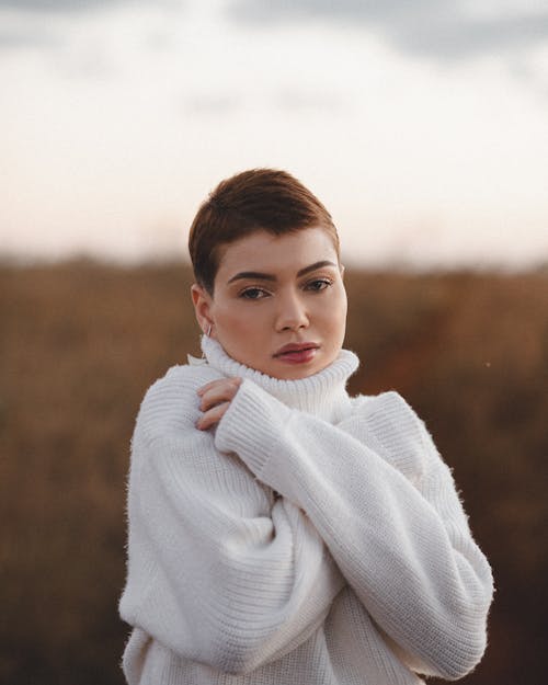 Woman in Woolen White Turtleneck Sweater