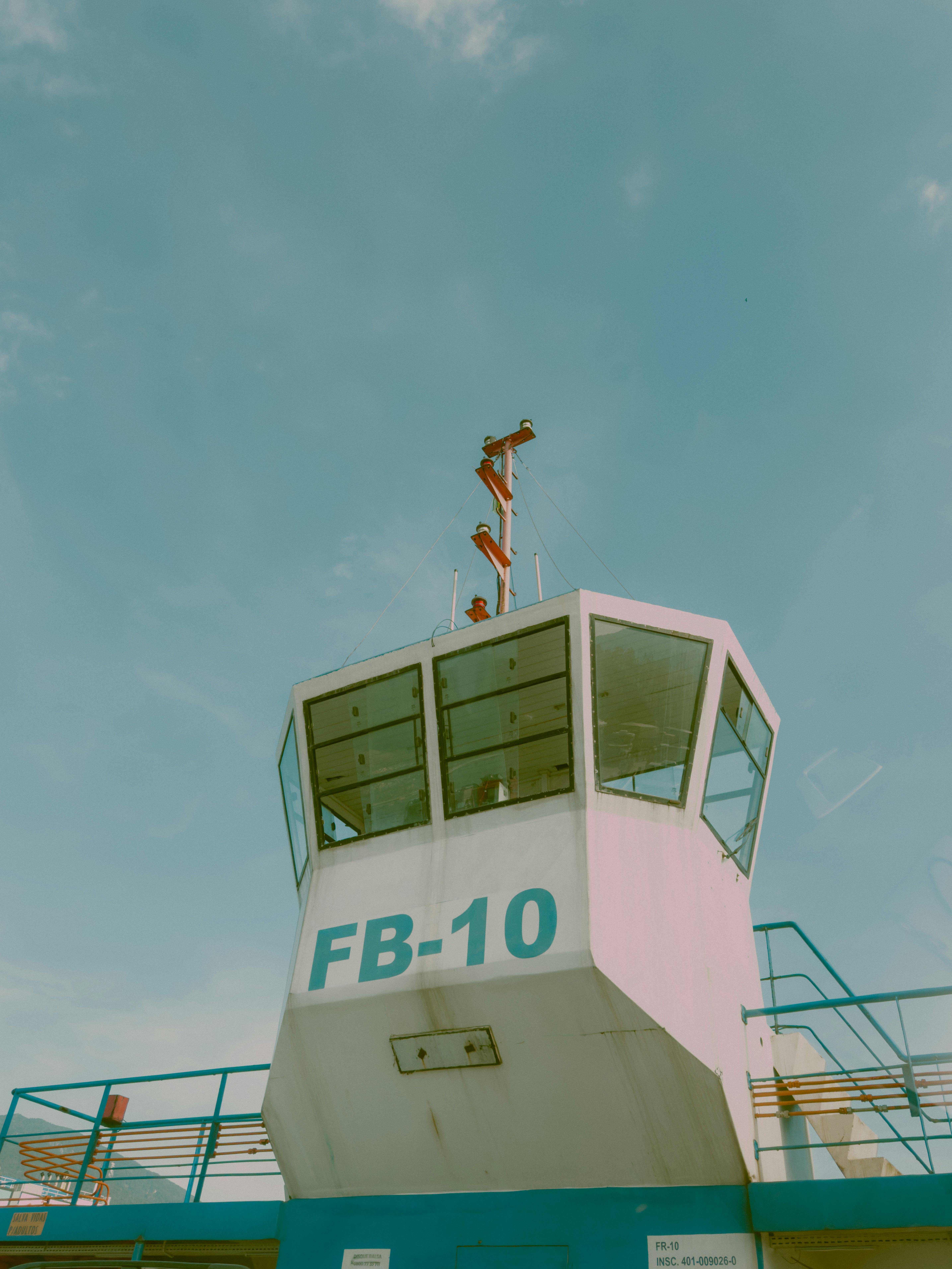 High-angle view of a tower structure against a clear blue sky, featuring a ship bridge.