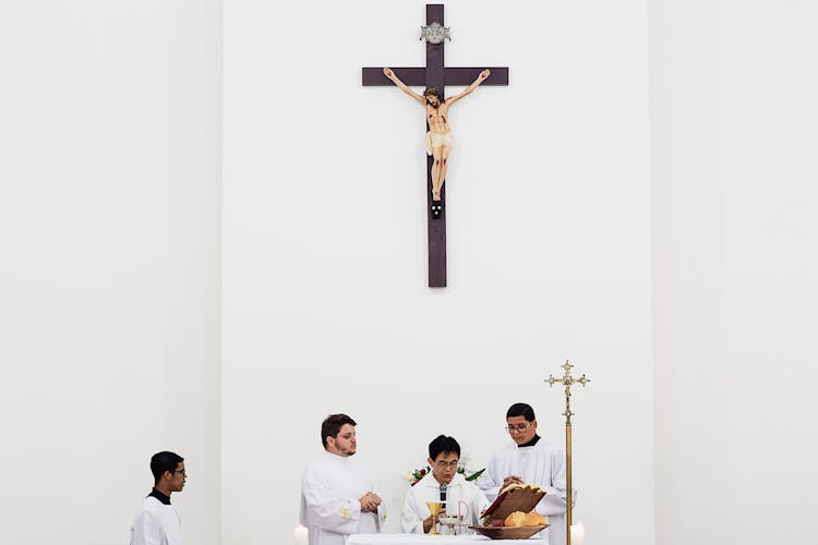 Priest Using Microphone