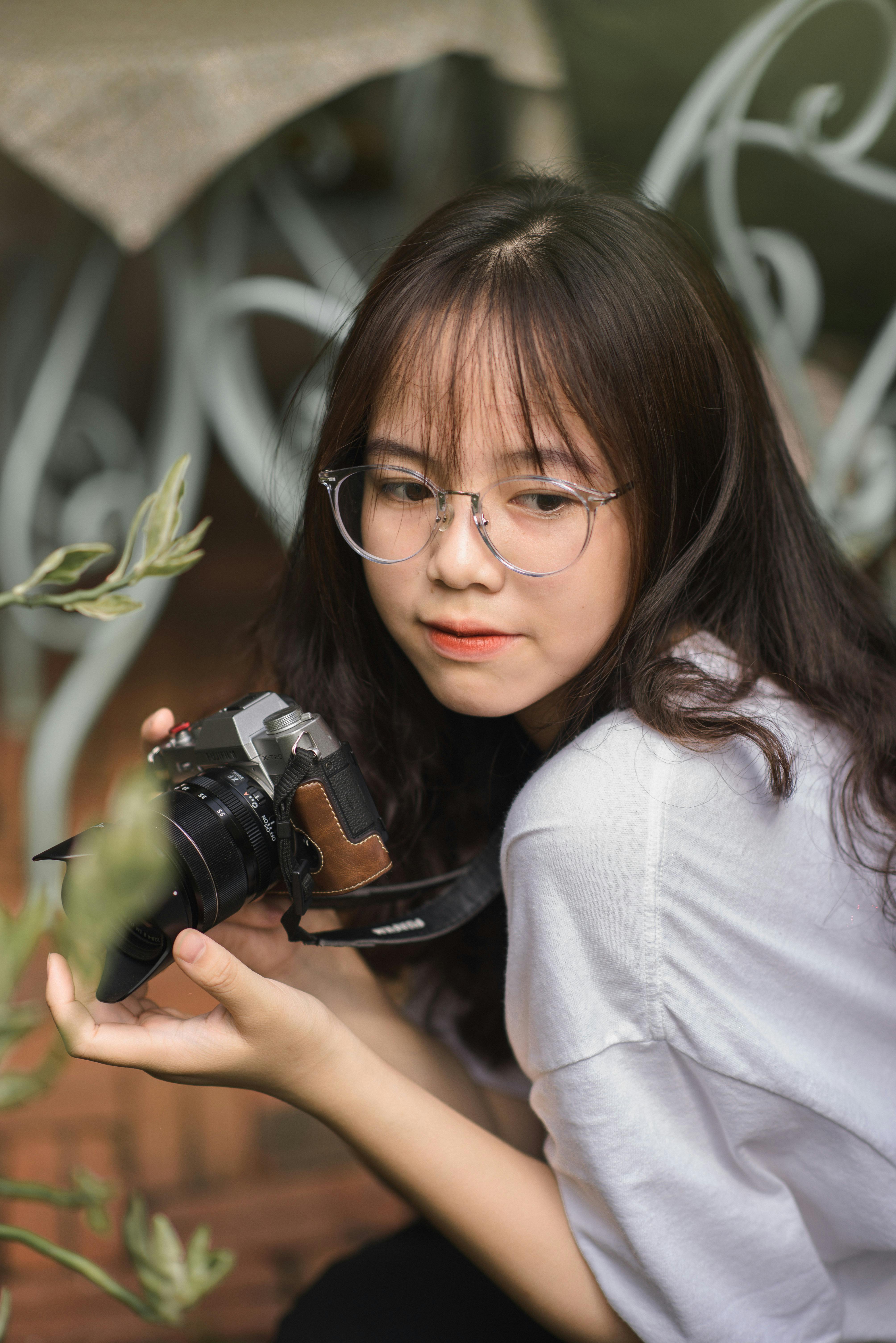 portrait of a woman with camera