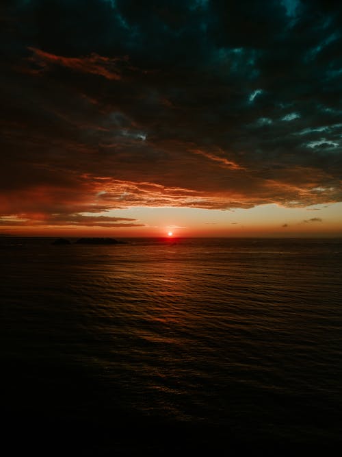 View of a Sea under a Dramatic Sunset Sky 