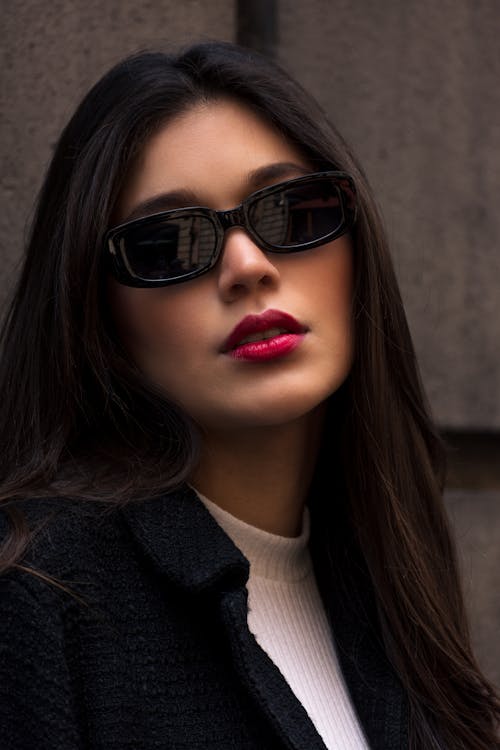 Brunette Woman in Black Blazer and Sunglasses