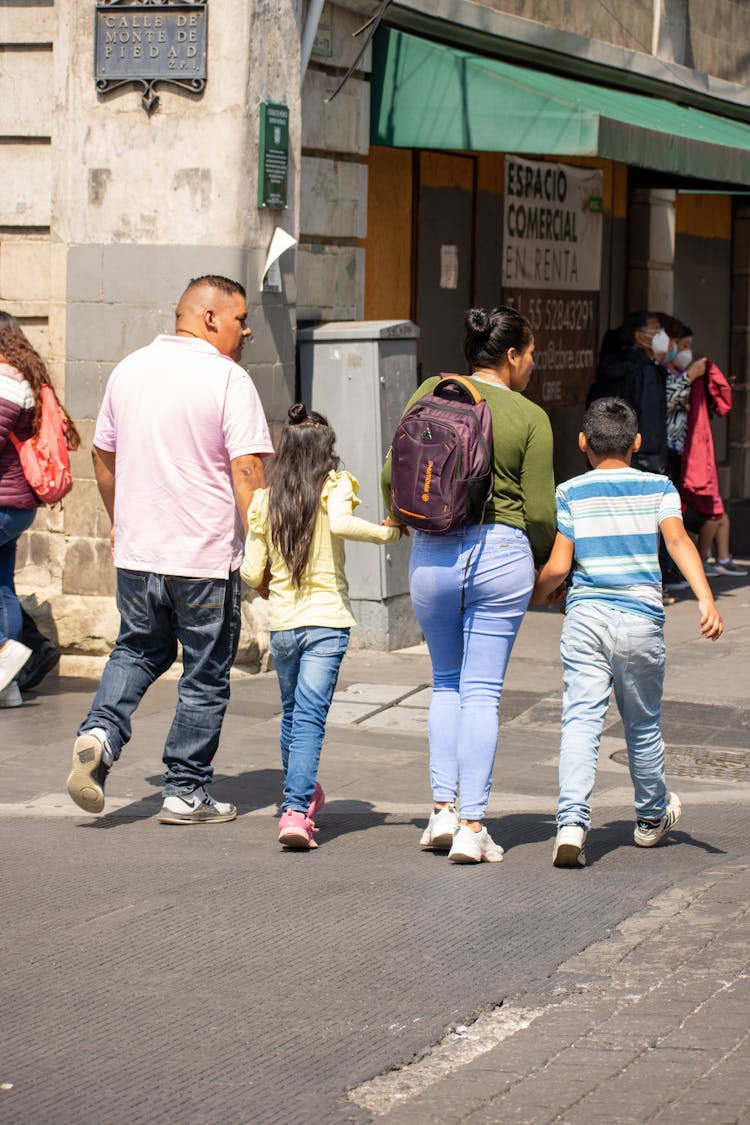 Family Crossing The Street