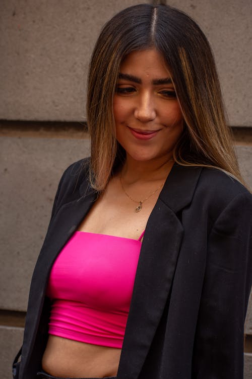Smiling Model in a Short Pink Blouse and Jacket