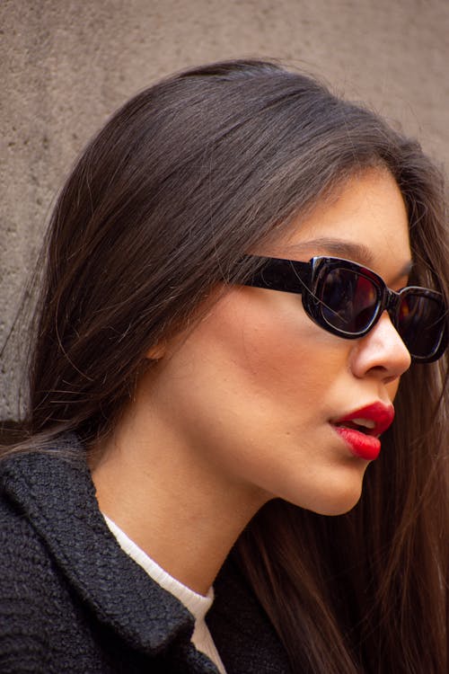 Close-Up Photo of a Brunette Woman in Sunglasses