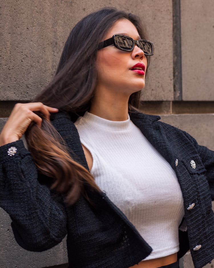 Model In Cropped Tank Top And Jacket