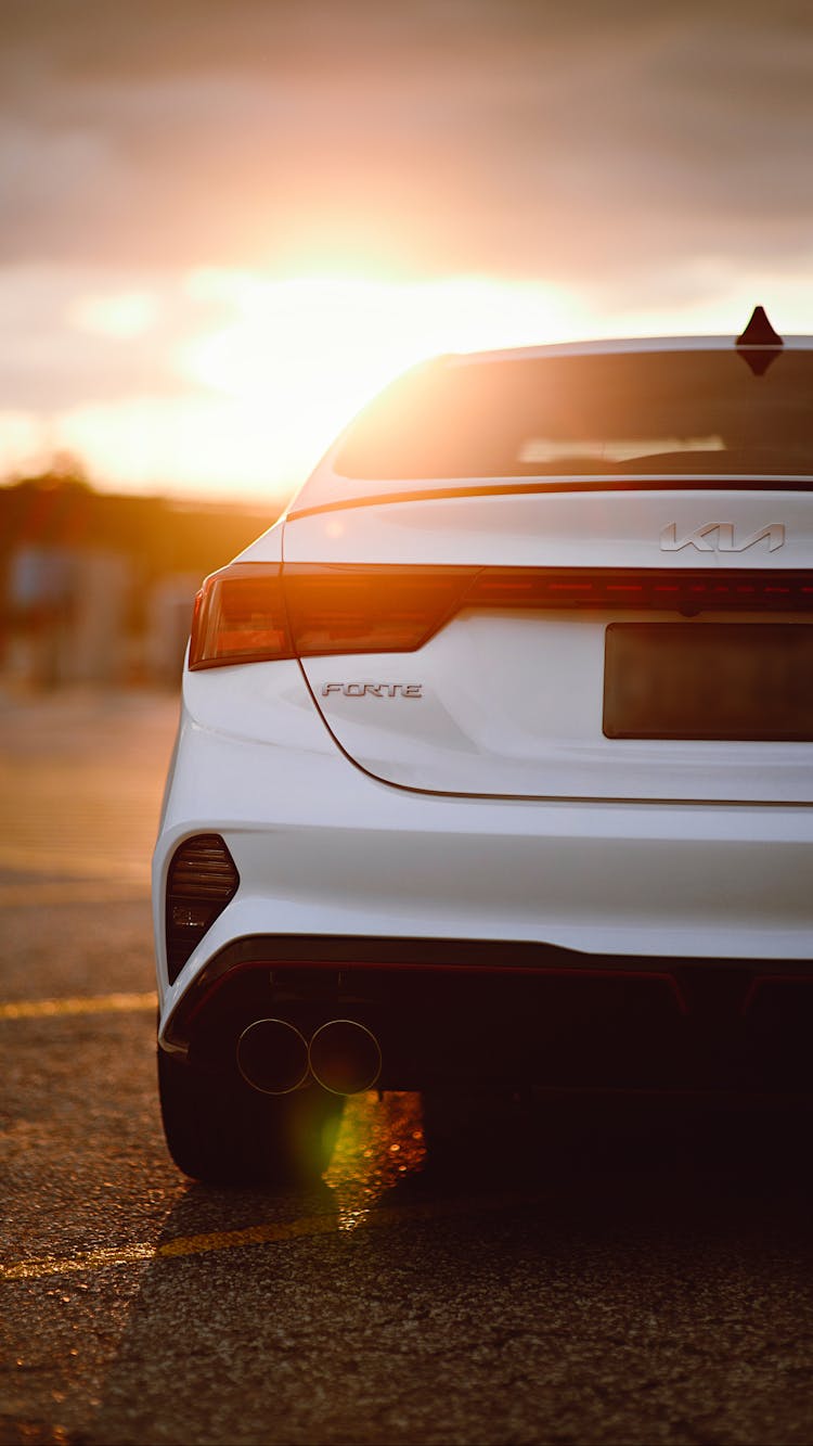 Car On A Parking Lot At Sunset 