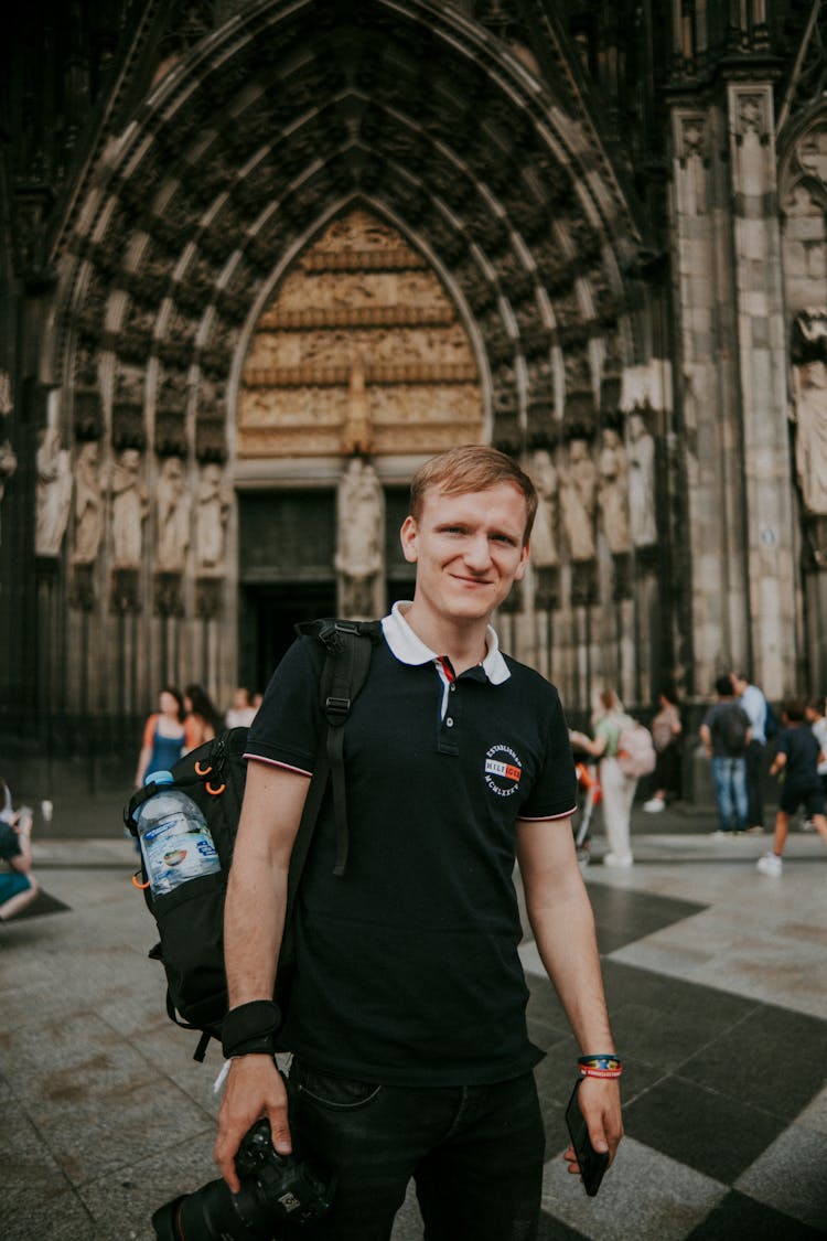 Man In Front Of Antique Church 