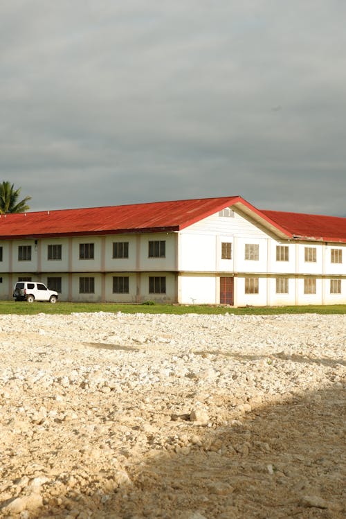 View of a White Building with a Red Roof
