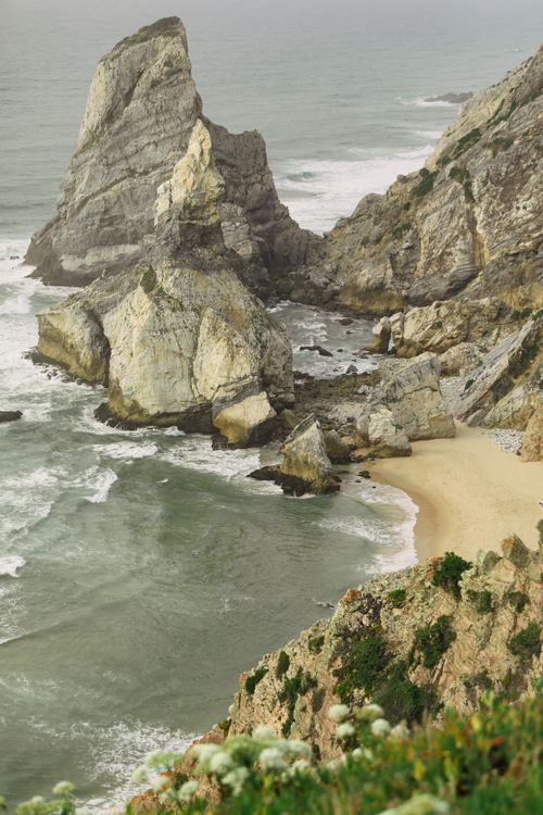 Free Stunning view of Ursa Beach with majestic rock formations and crashing waves in Portugal. Stock Photo