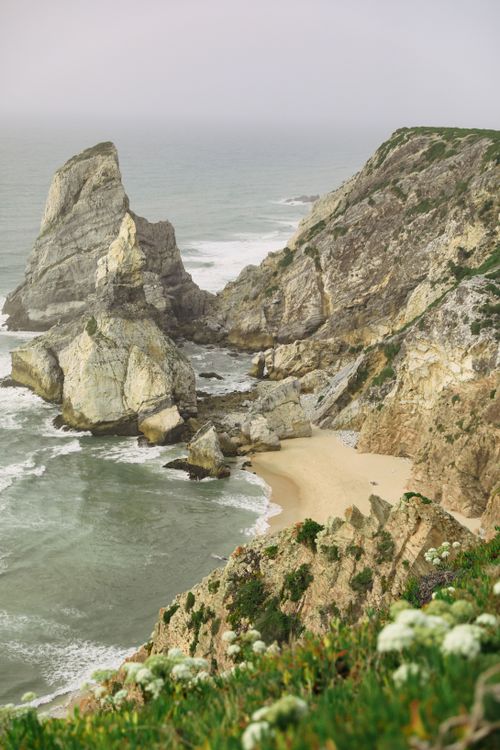 Free Scenic view of Ursa Beach with rugged cliffs and ocean waves in Portugal. Stock Photo