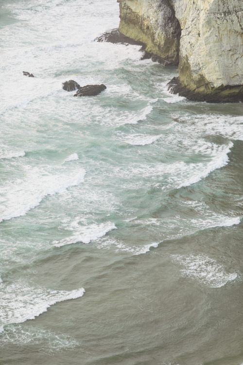 Free A breathtaking view of ocean waves crashing against a rocky coastline, showcasing the wild beauty of nature. Stock Photo