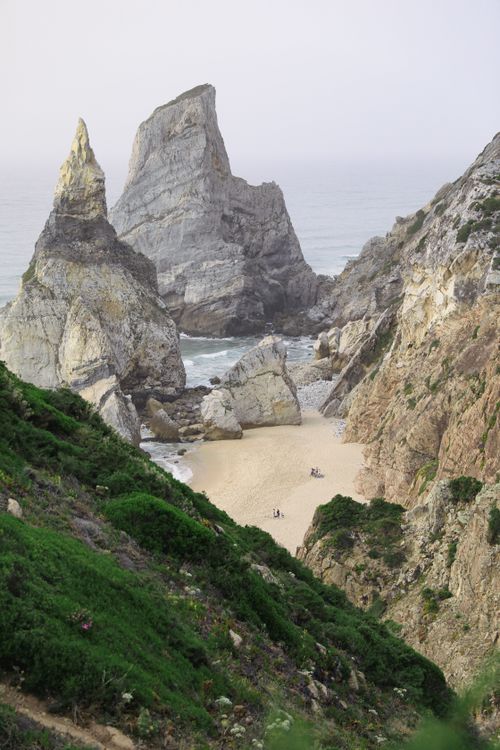 Free Stunning rock formations at a secluded beach on a cloudy day. Stock Photo