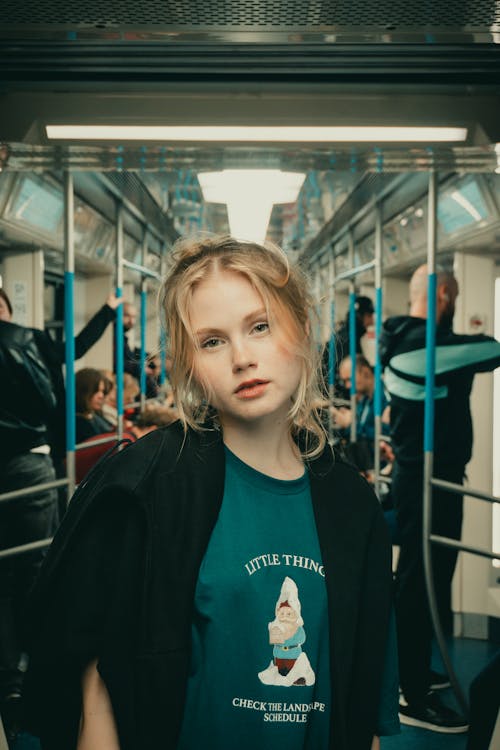 Blonde Woman Standing in Tram