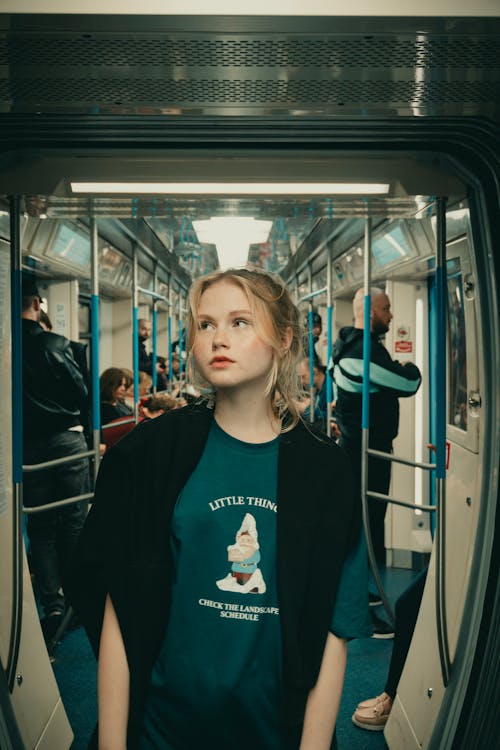 Looking Up Girl Standing in Tram