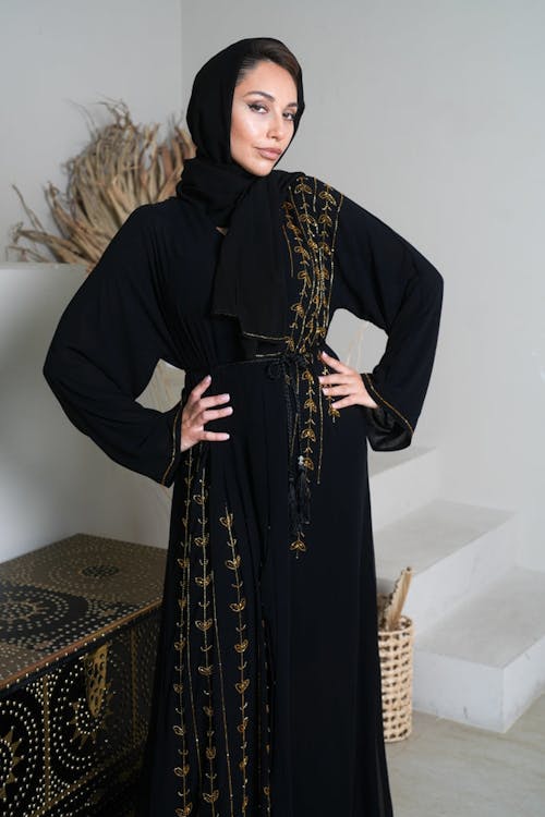 Woman Wearing Black Traditional Gown