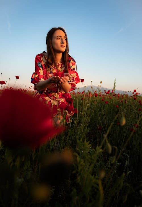 A woman in a field of poppies