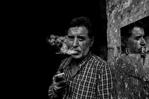 A Man Smoking a Cigarette 