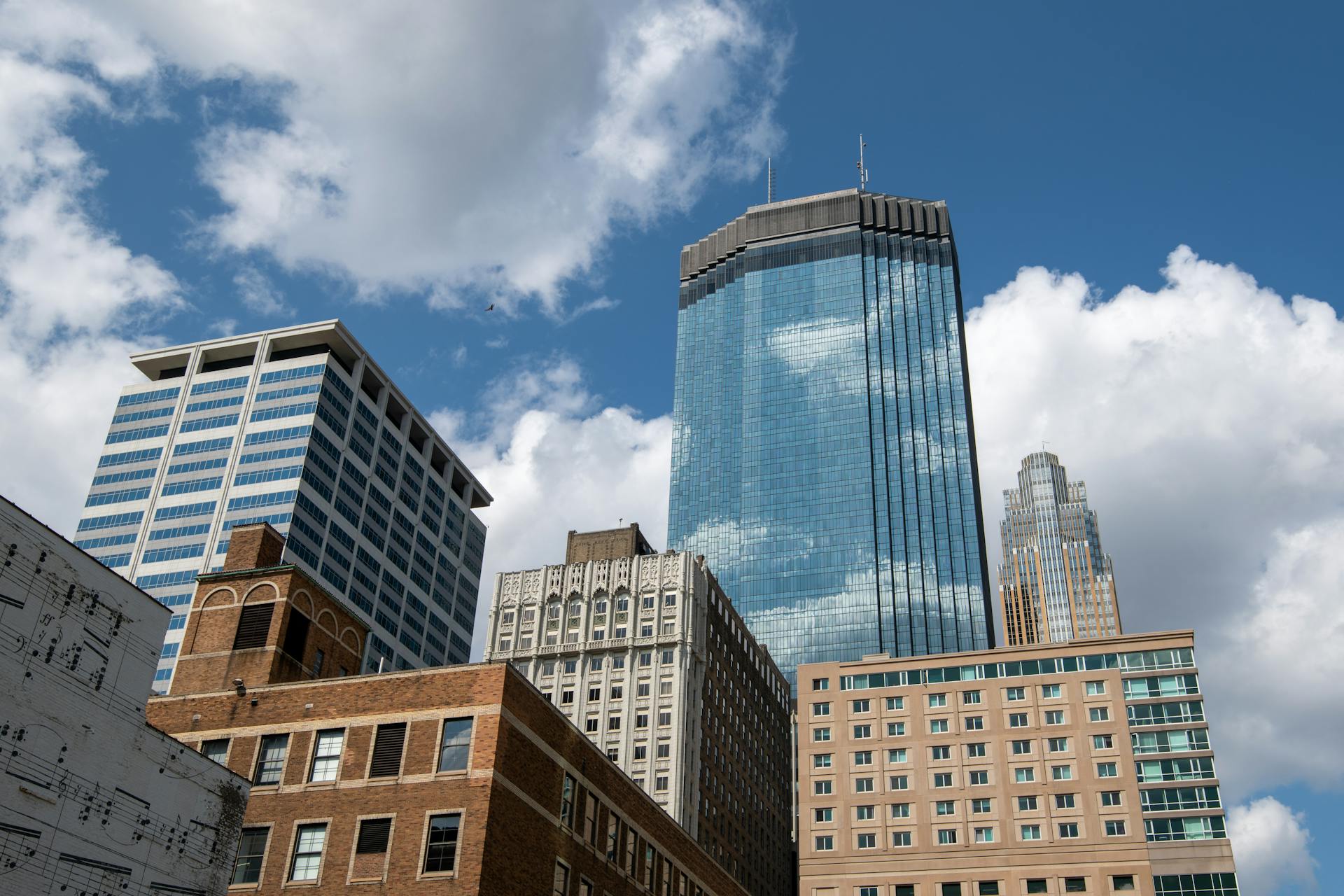 Vibrant cityscape of Minneapolis showcasing tall skyscrapers against a blue sky.