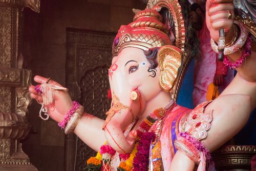 Free Colorful Ganesh statue adorned with flowers during Ganesh Chaturthi in Mumbai, India. Stock Photo