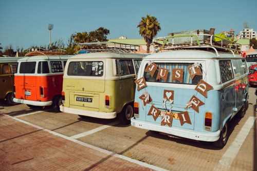 Free Vibrant Volkswagen camper vans parked at Boumerdès, exuding a nostalgic summer vibe. Stock Photo