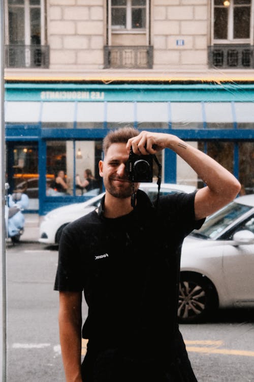 Photographer Taking Selfie in Mirror on Street