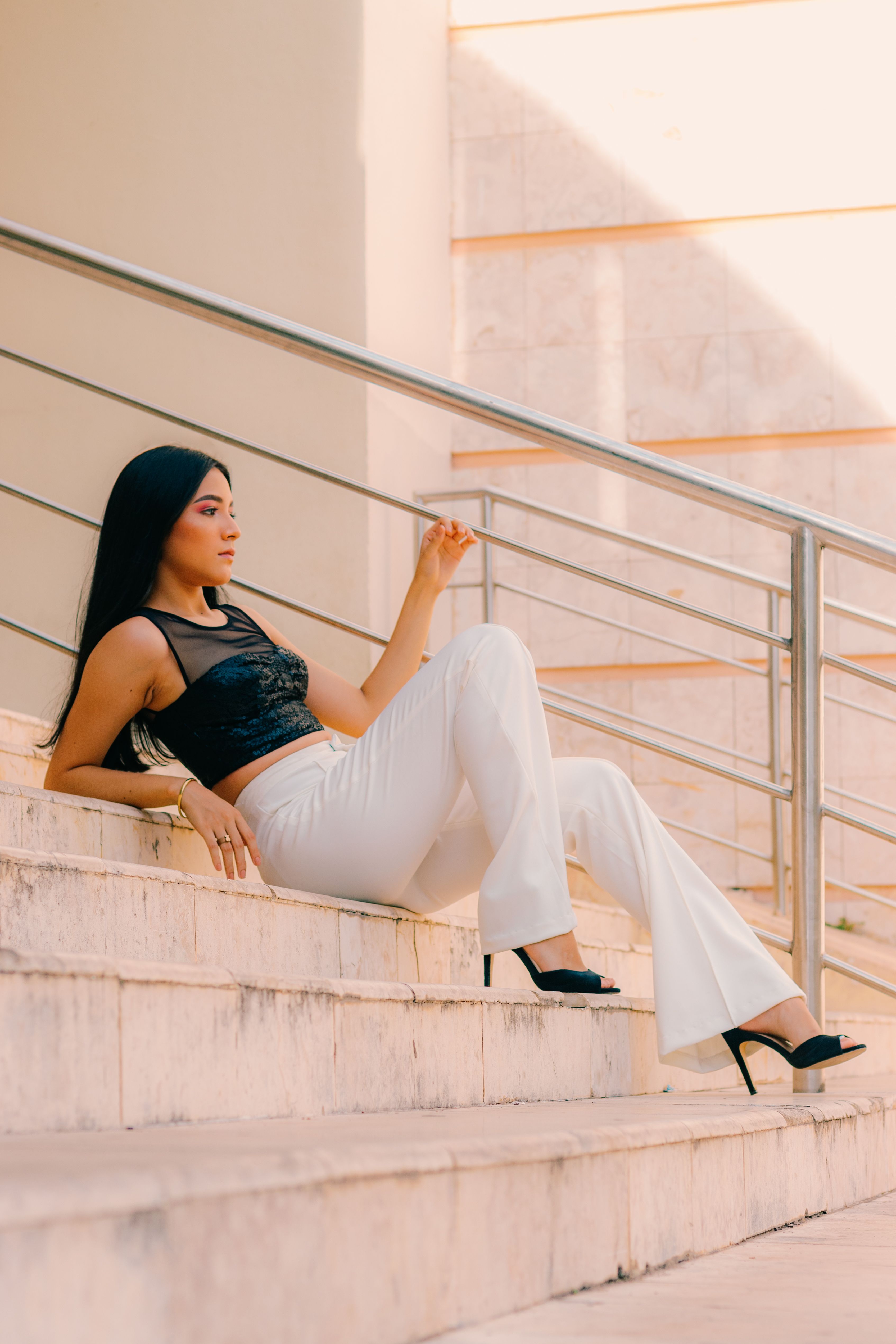 Woman in White Pants Sitting on Stairs · Free Stock Photo
