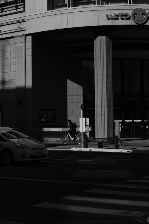 Black and White Photo of Street by Building Corner