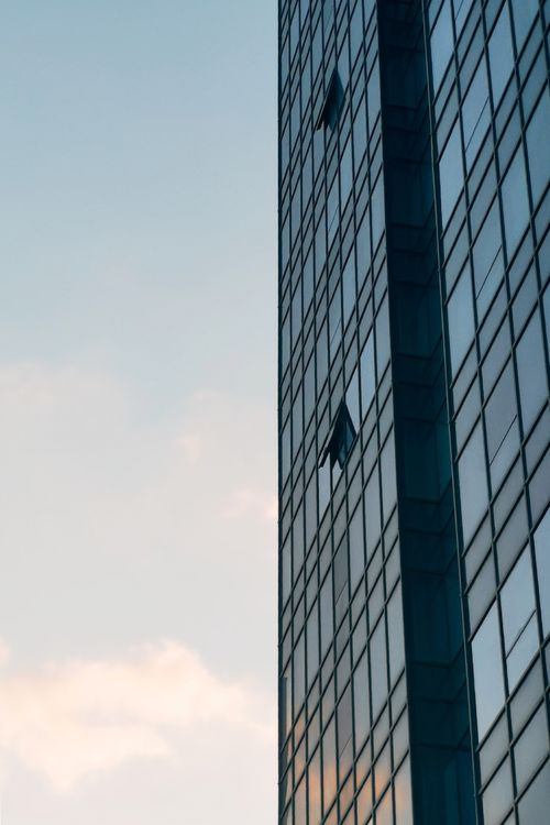 Free Sleek modern skyscraper facade with reflective glass windows in Anhui, China. Stock Photo