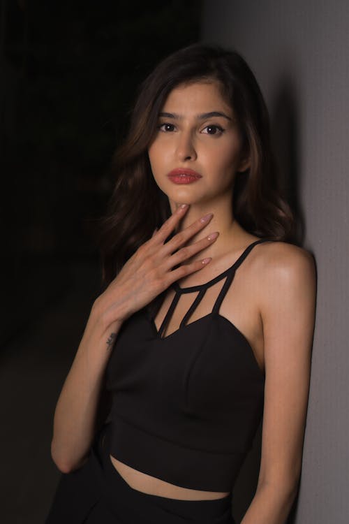 Free A woman in a black top posing for a photo Stock Photo