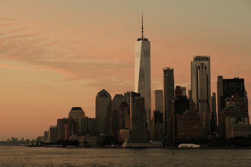 Waterfront of lower Manhattan with One World Trade Center at Dusk