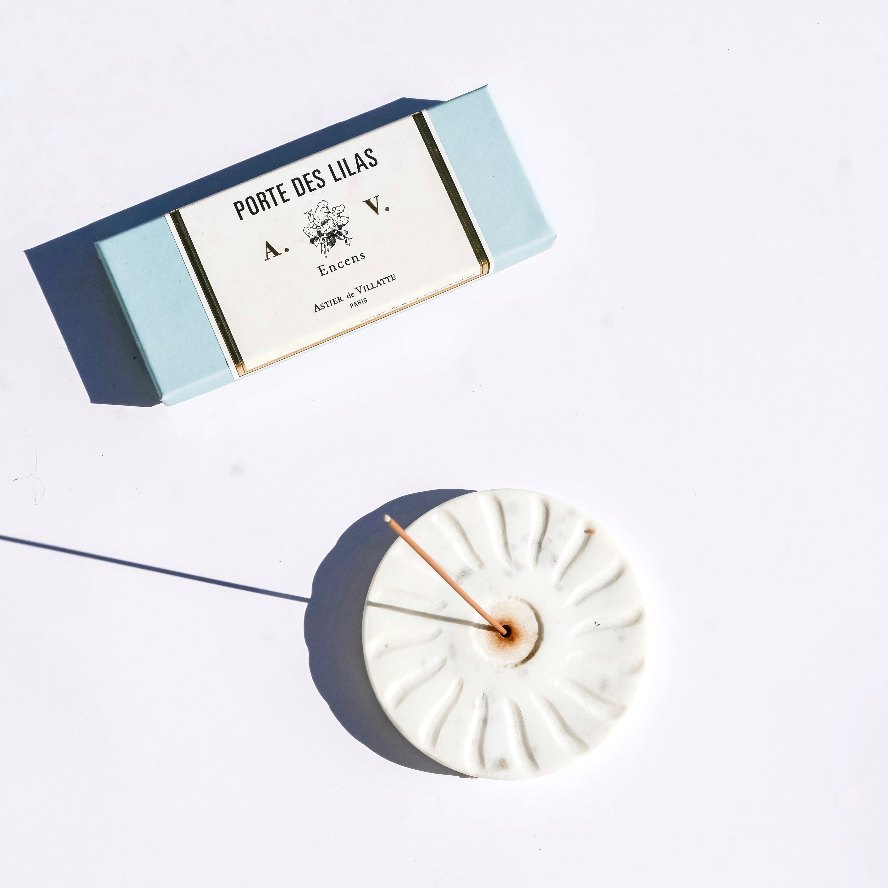 Incense Stick in a Stand and Packaging