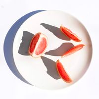 Grapefruit segments on a plate — Studio Naae on Pexels