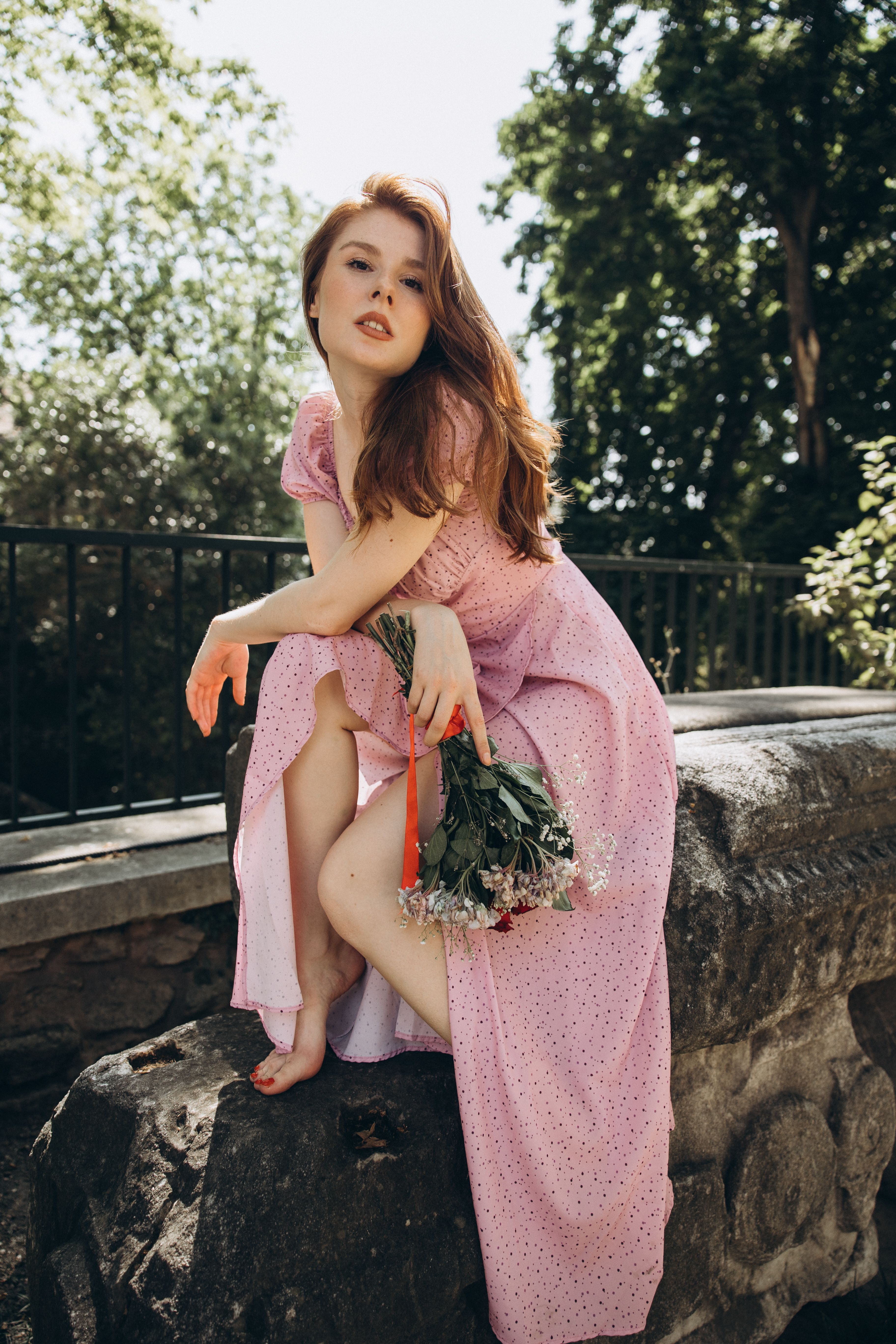 Redhead Model Posing in Pink Dress  Free Stock Photo