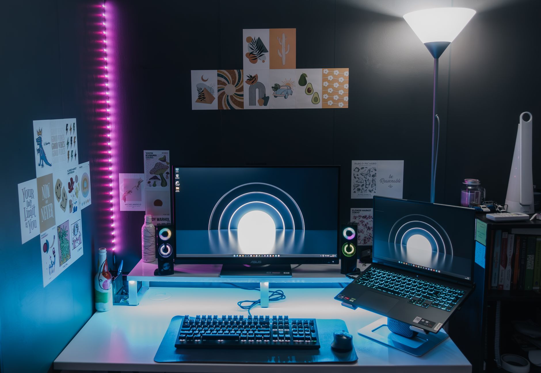 Stylish gaming setup featuring dual monitors, LED lighting, and tech accessories for an immersive experience.