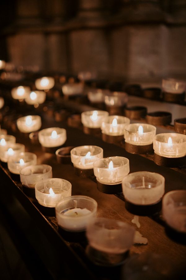 Rows of lit prayer candles
