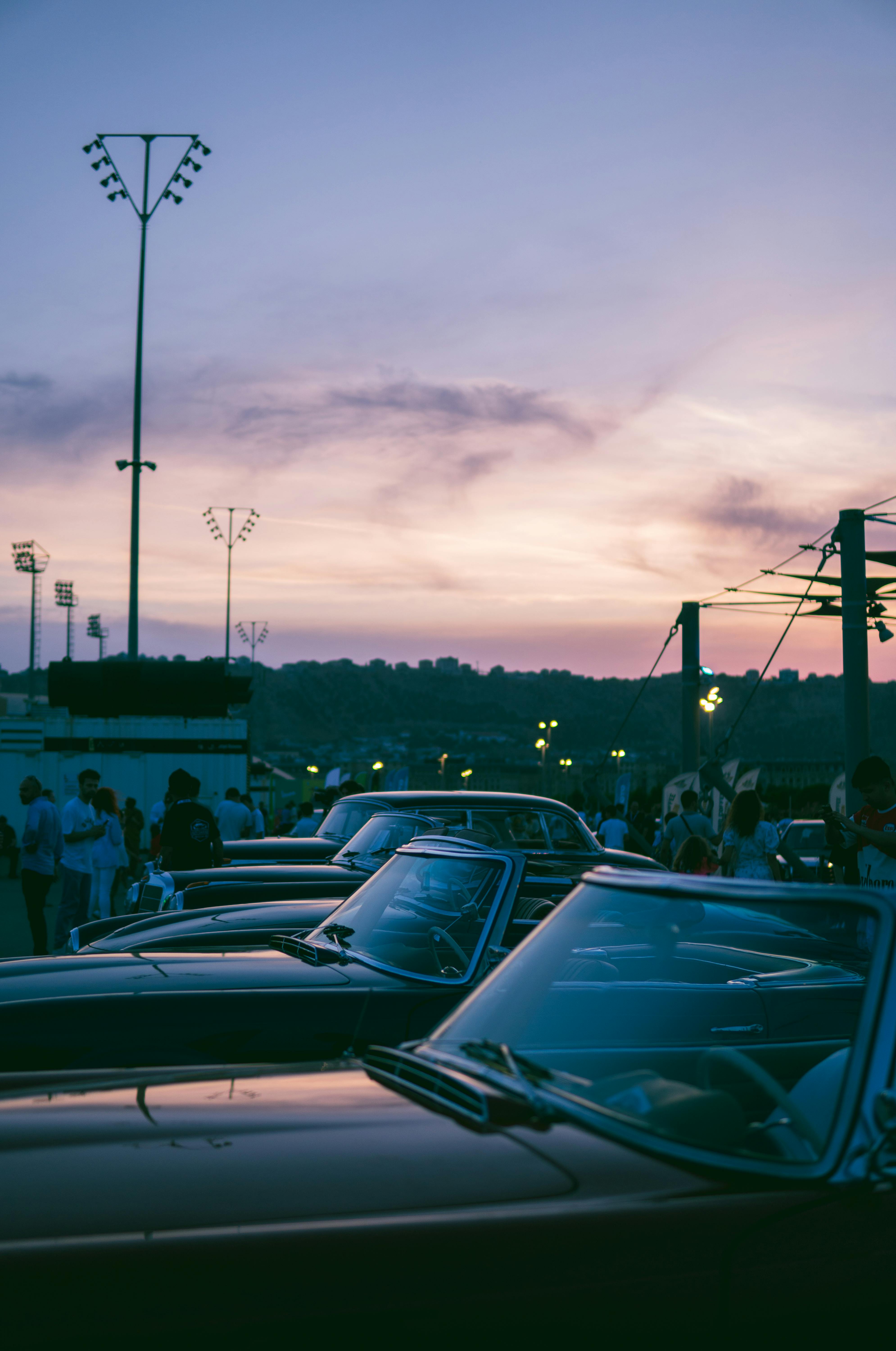 Classic cars displayed at a sunset exhibition in Baku, Azerbaijan.