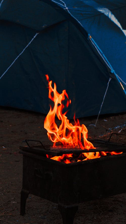 A Bonfire and a Tent on a Campsite