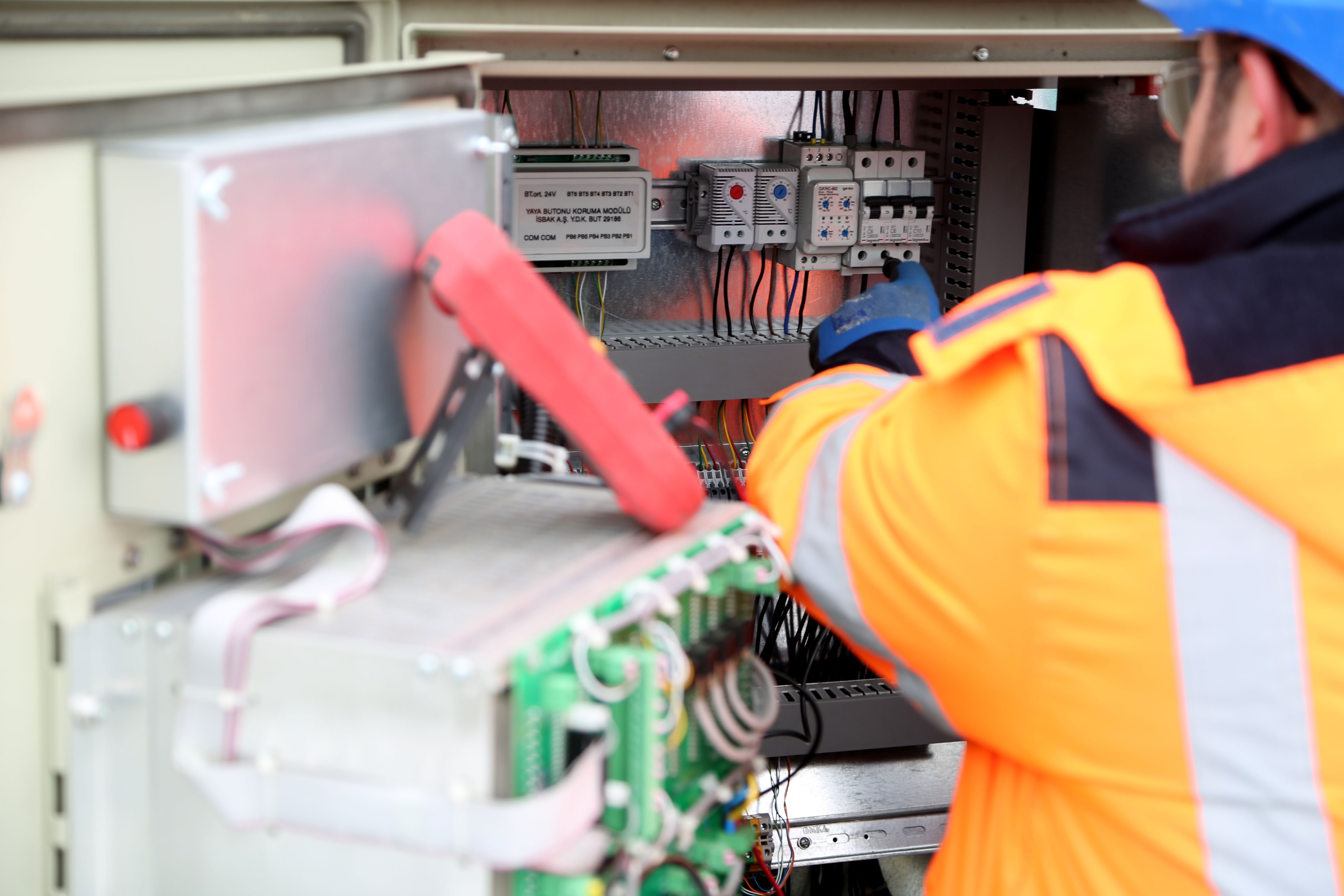 Image Name electrician inspecting electrical system outdoors
