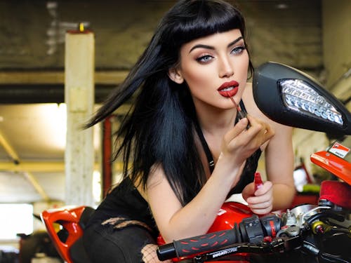 A Woman with a Lipstick on a Motorcycle 
