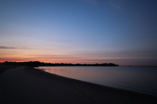 akşam karanlığı, deniz, gün batımı içeren Ücretsiz stok fotoğraf