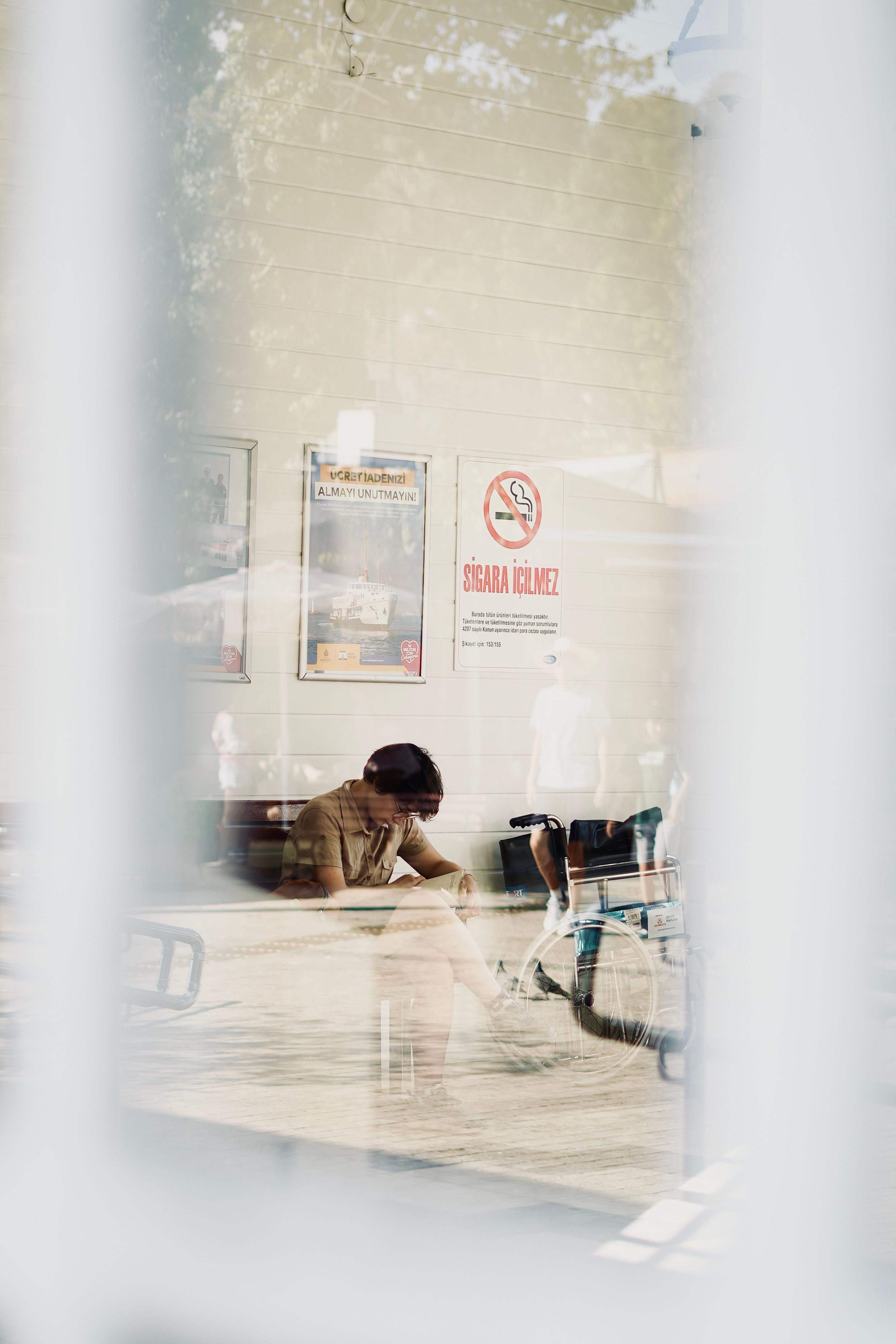 Patient seated in a bright hospital waiting area