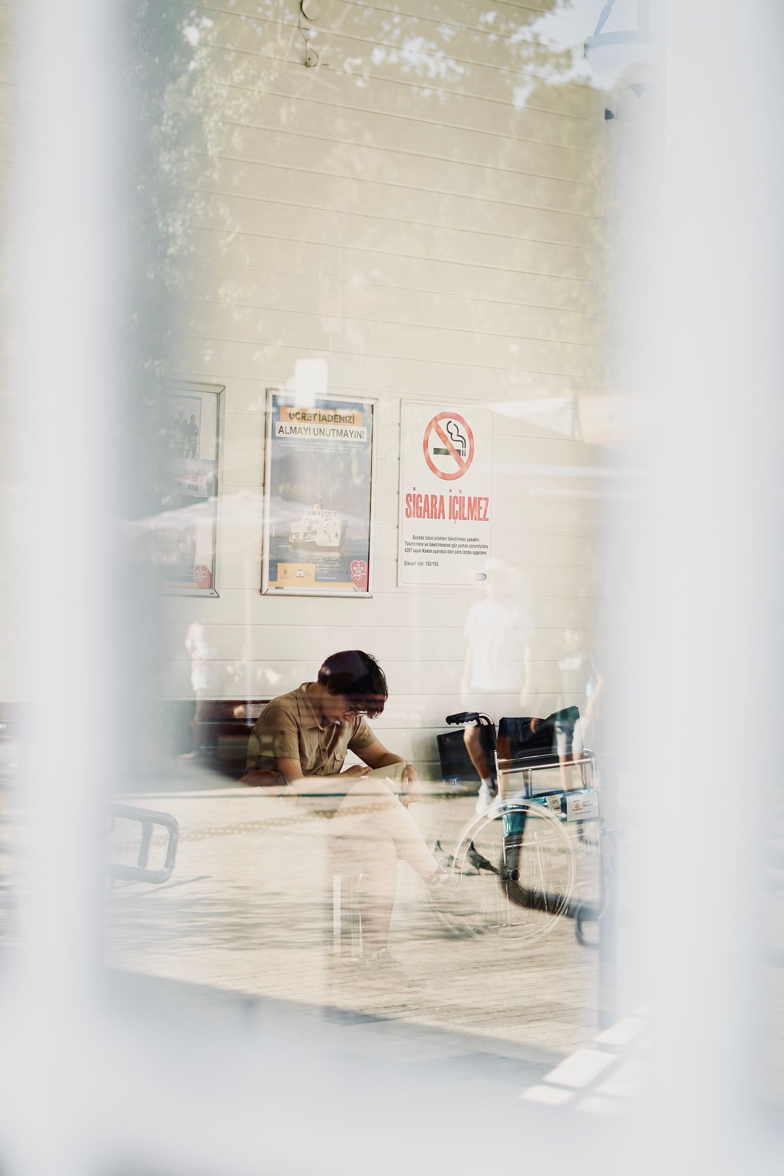 Patient seated in a bright hospital waiting area