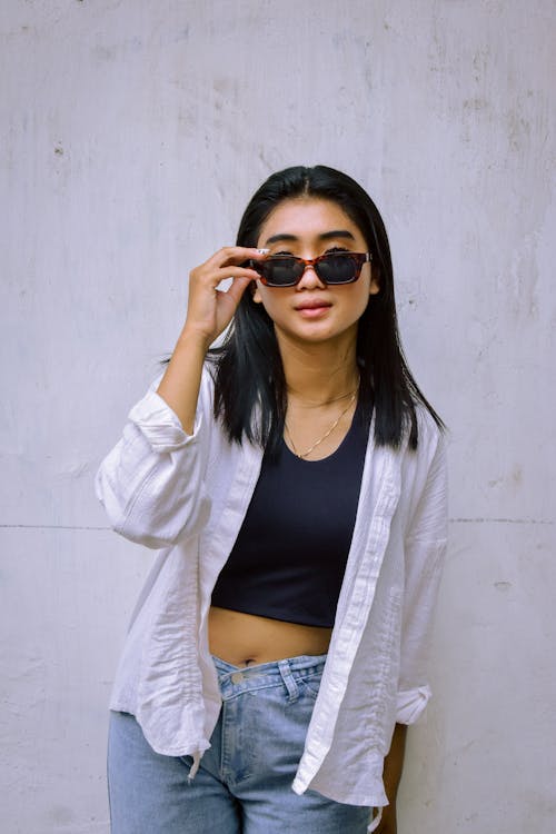 Young Model in an White Blouse on a Black Crop Top