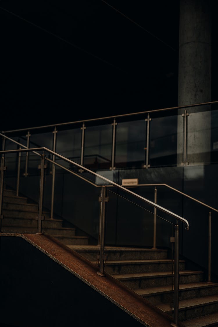 A Modern Staircase With Glass Railing 