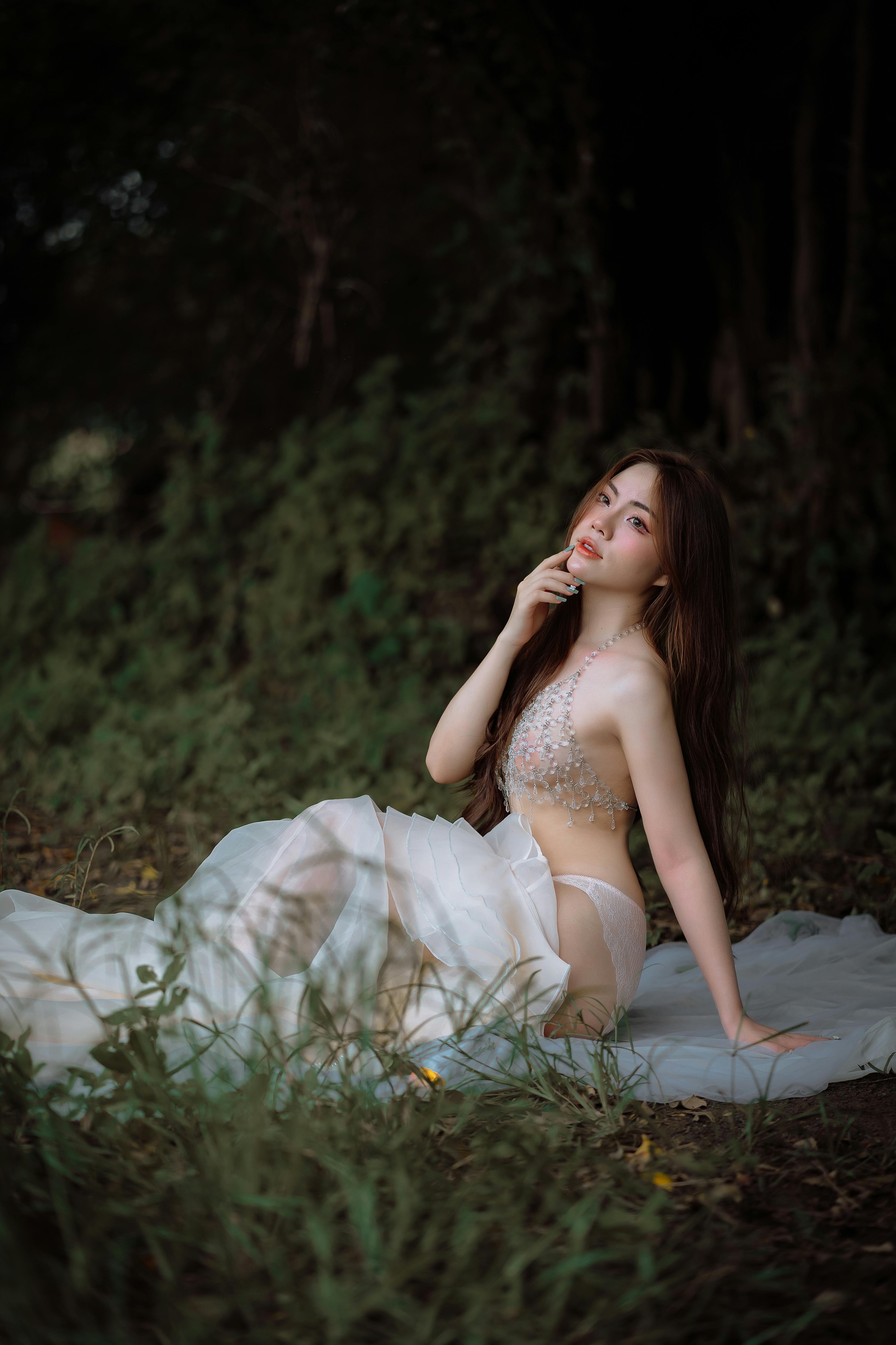 Sexy Asian Woman in Lingerie Sitting on Ground in Nature  Free Stock Photo