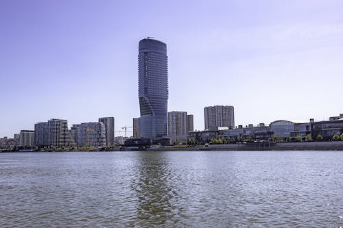 River and a City Waterfront with Blocks of Flats