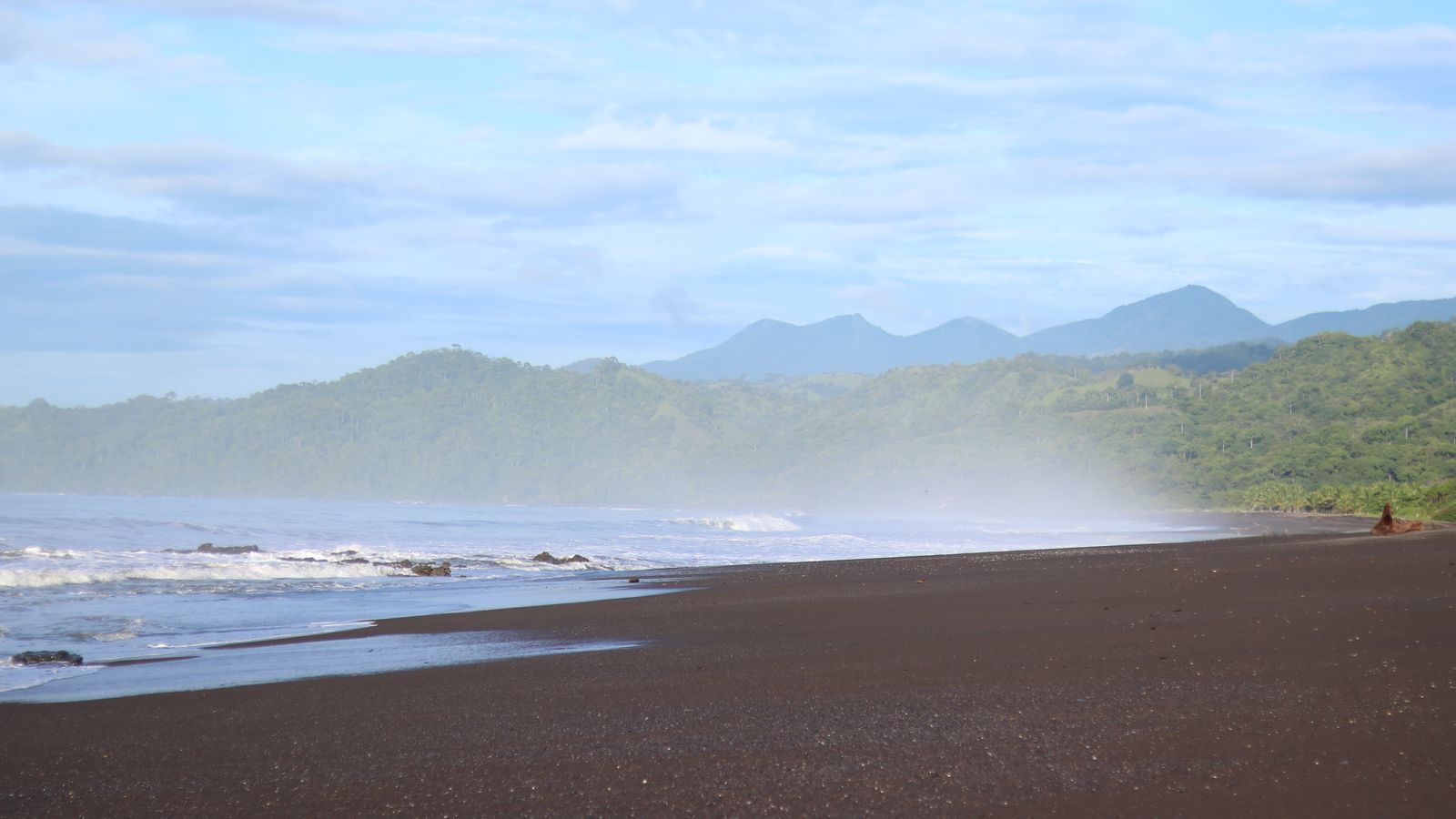 Breeze on a sandy beach and mountain landscape, Equatorial Guinea